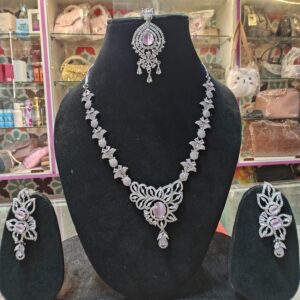 Pink a touch of luxury to your style with this stunning American Diamond necklace.